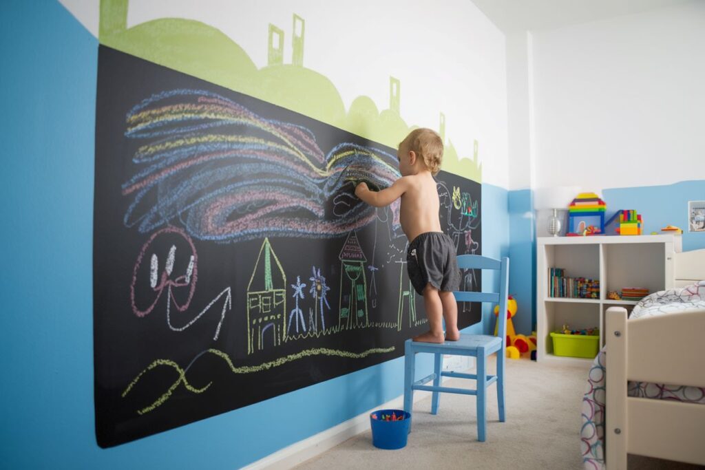 Partial wall of a toddler boy's room painted with chalkboard paint